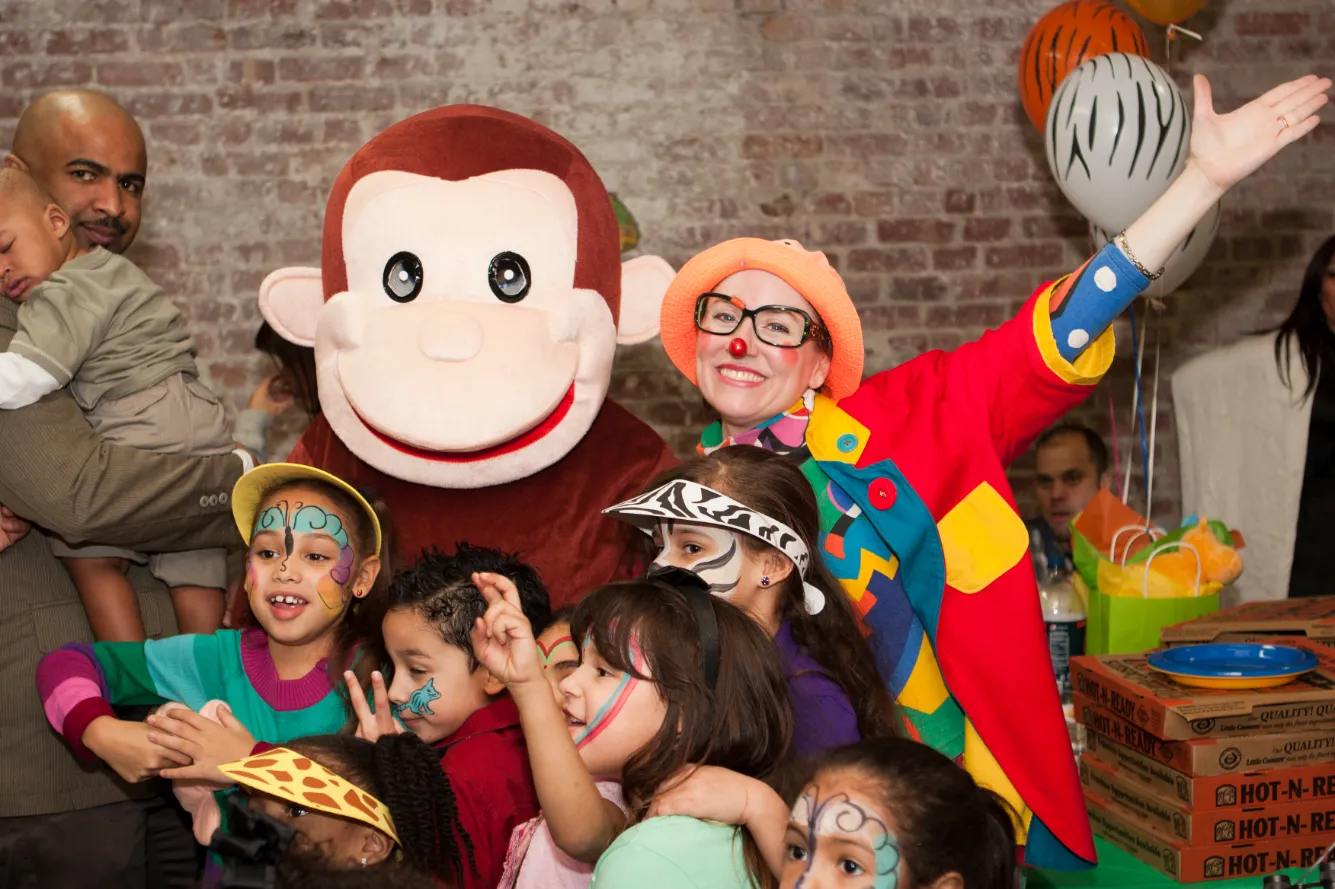 Clown and monkey character entertainers at a kids birthday party
